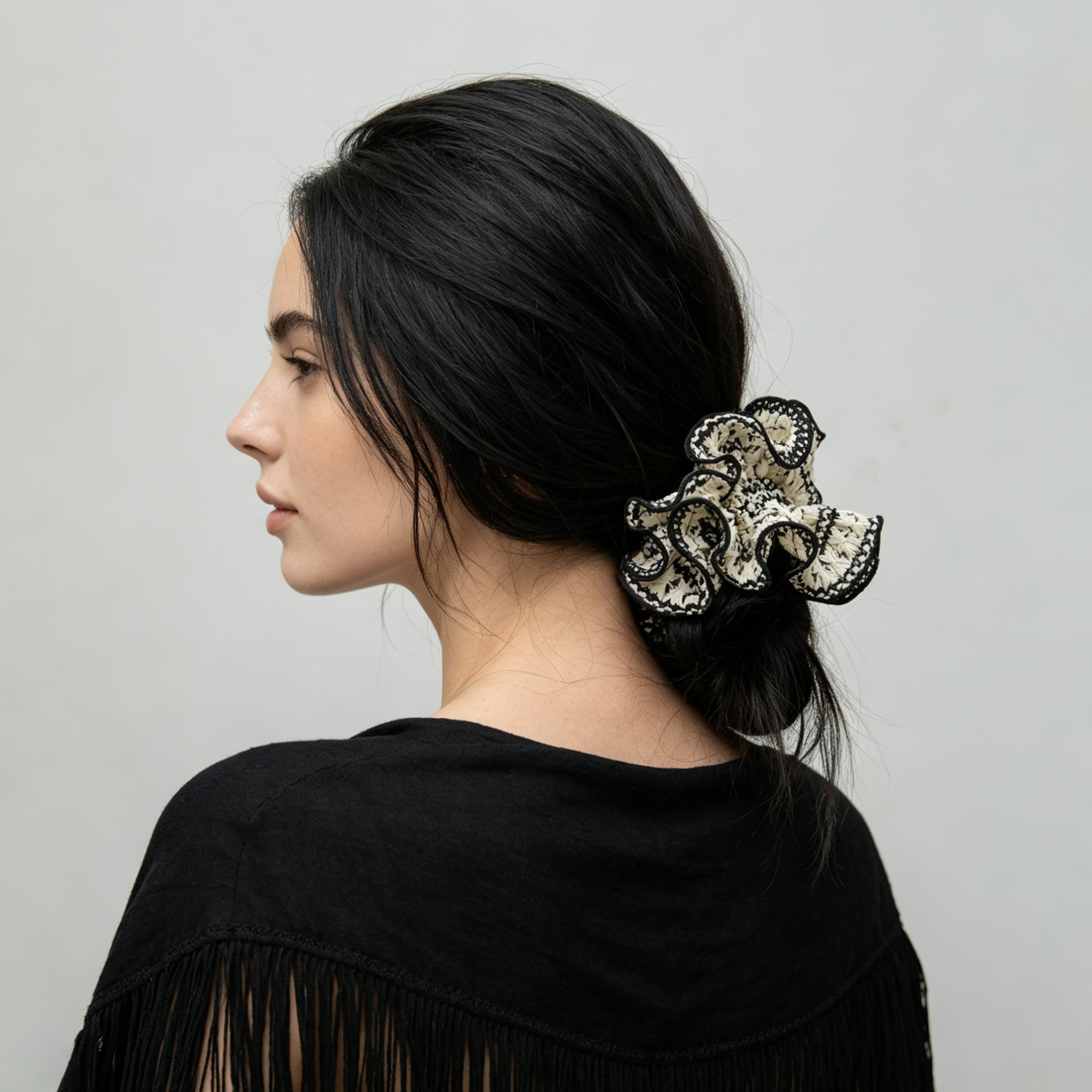 Hand-knitted black lattice scrunchie with white 3D petals by Tide Tie