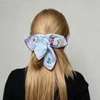 Sky-blue scarf tie with embroidered bunnies and wildflowers by Tide Tie