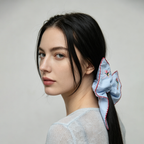Sky-blue scarf tie with embroidered bunnies and wildflowers by Tide Tie