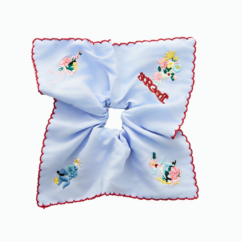 Sky-blue scarf tie with embroidered bunnies and wildflowers by Tide Tie